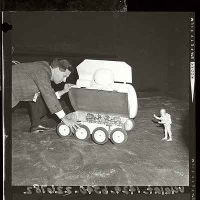 Pictured above is a November 22, 1964 photo of William Sponsler, a designer of the Lunar Surface Vehicle at Northrop Space Laboratories. In the photo he's checking the mechanism of a one-sixth scale model as it moves over a rubbled replica of moon surface. Over five years later on  July 31, 1971 the first lunar rover would make it debut during the Apollo 15 mission.